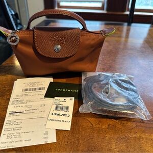 LE PLIAGE GREEN POUCH WITH HANDLE, COGNAC